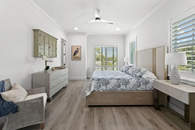 a view of a chair and tables in the balcony
