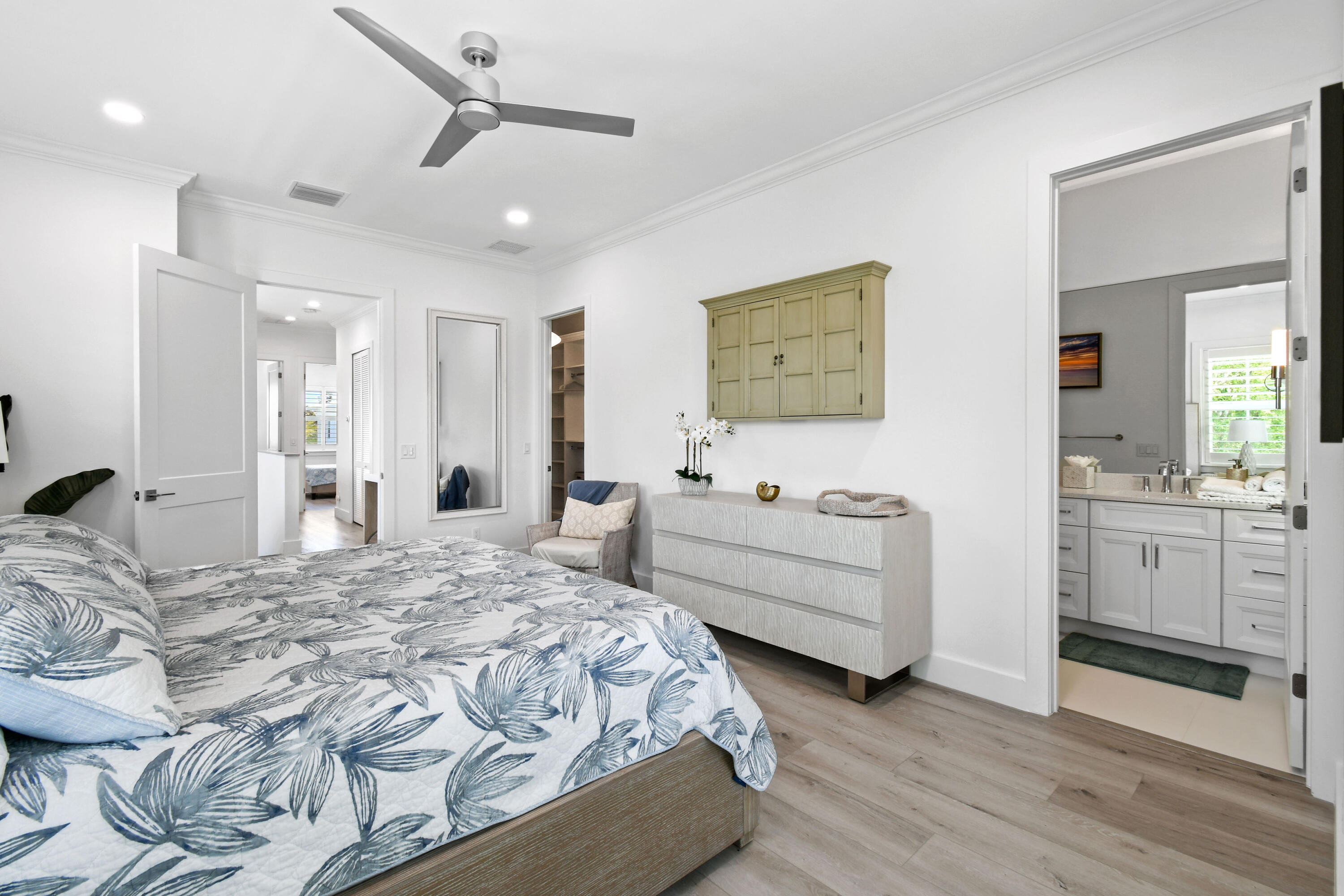 4650 Southeast Manatee Terrace Stuart, FL 34997 - Photo 24 of 95 a bedroom with a bed and a dresser