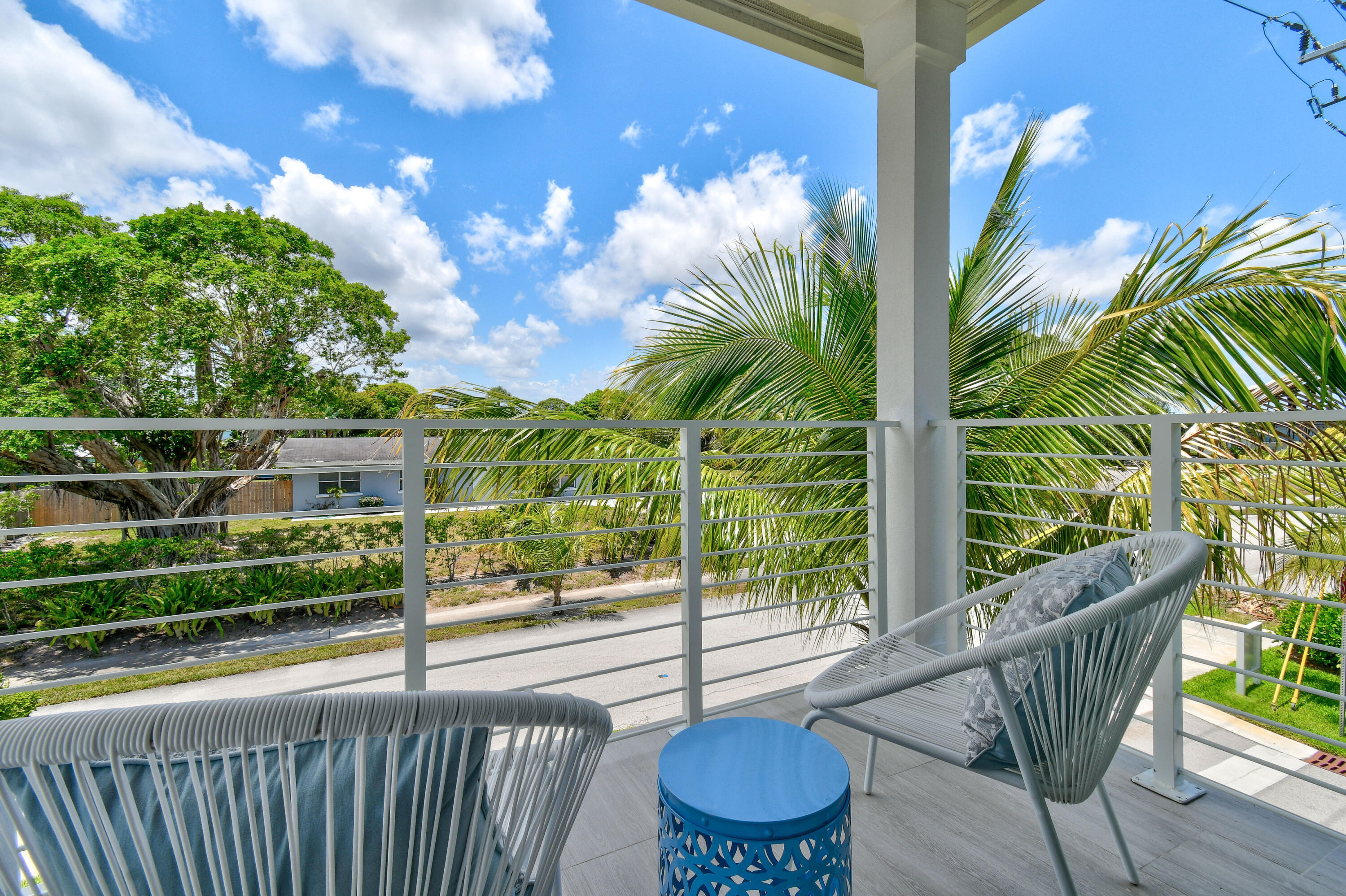 4650 Southeast Manatee Terrace Stuart, FL 34997 - Photo 29 of 95 a view of a chair and tables in the balcony