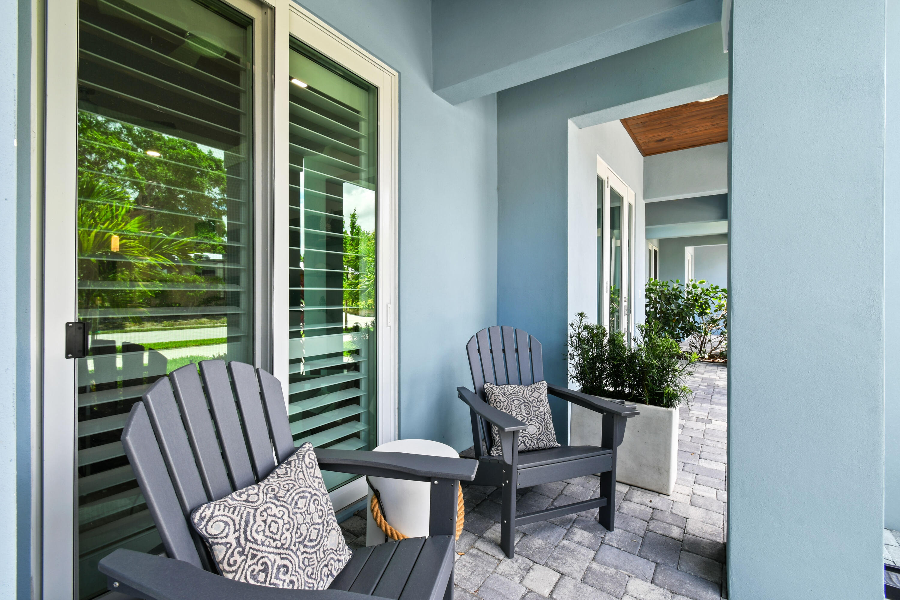 4650 Southeast Manatee Terrace Stuart, FL 34997 - Photo 3 of 95 a view of a two chair in the porch