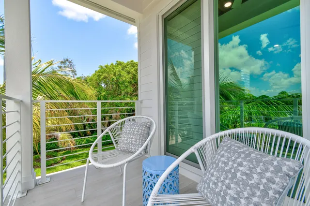 a view of a lake with houses in the background