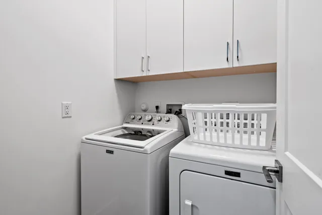 an aerial view of a house with a lake view