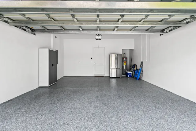 an aerial view of residential houses with outdoor space and swimming pool