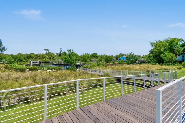 an aerial view of a house with a big yard