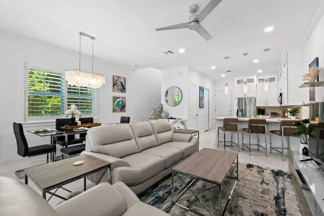 a workspace with furniture and a large window