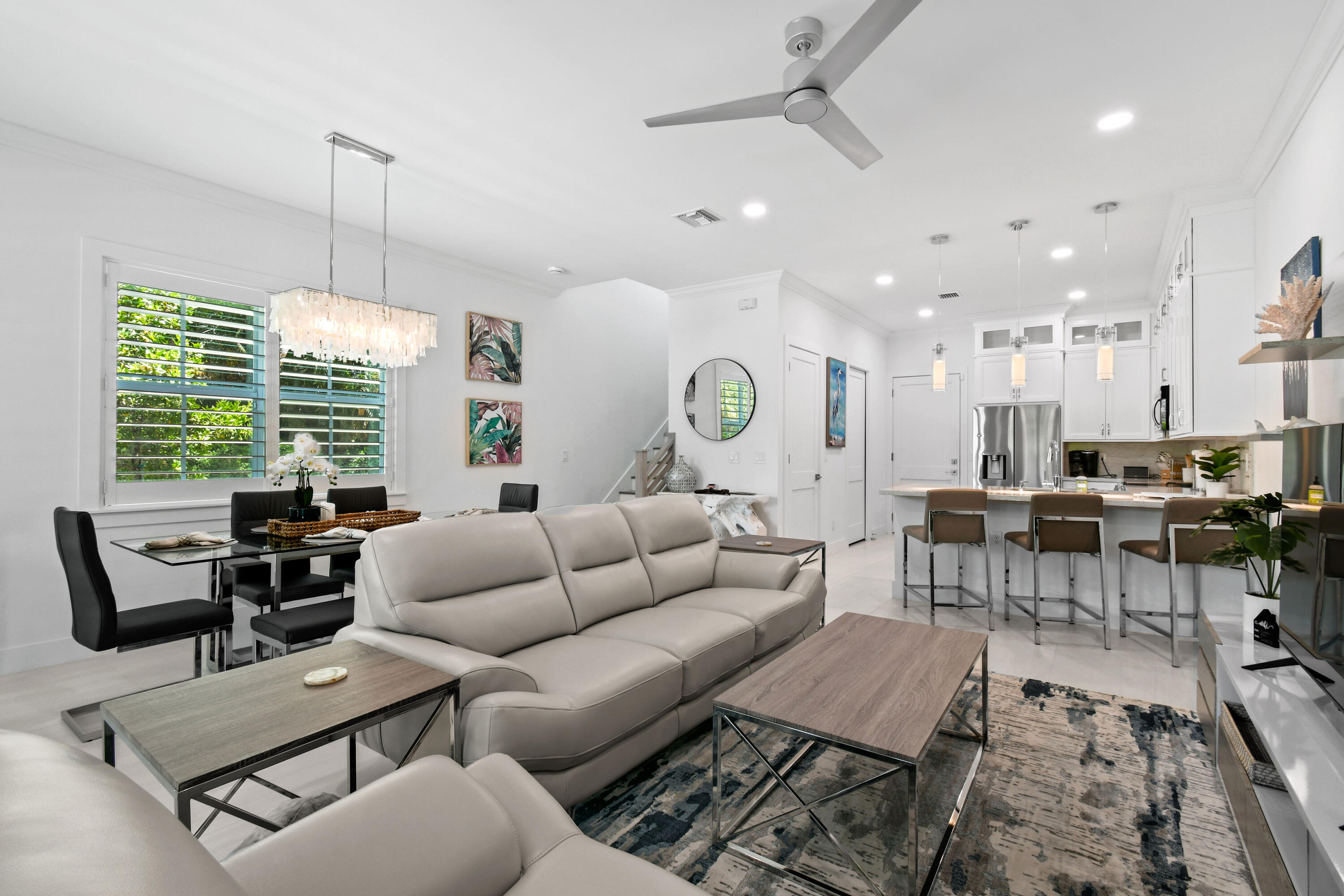 4650 Southeast Manatee Terrace Stuart, FL 34997 - Photo 6 of 95 a living room with furniture and a large window