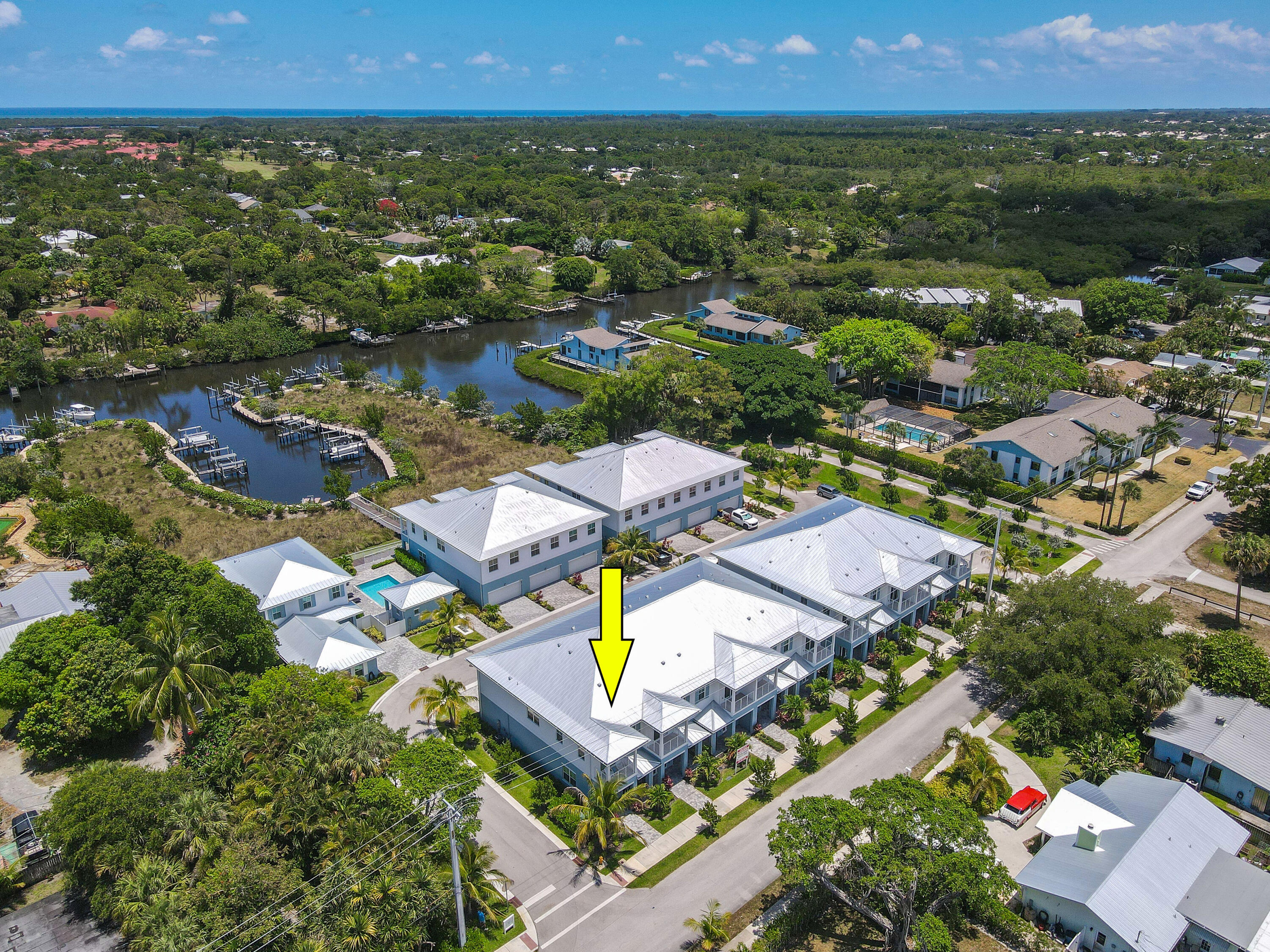 4650 Southeast Manatee Terrace Stuart, FL 34997 - Photo 71 of 95 an aerial view of residential houses with outdoor space and swimming pool