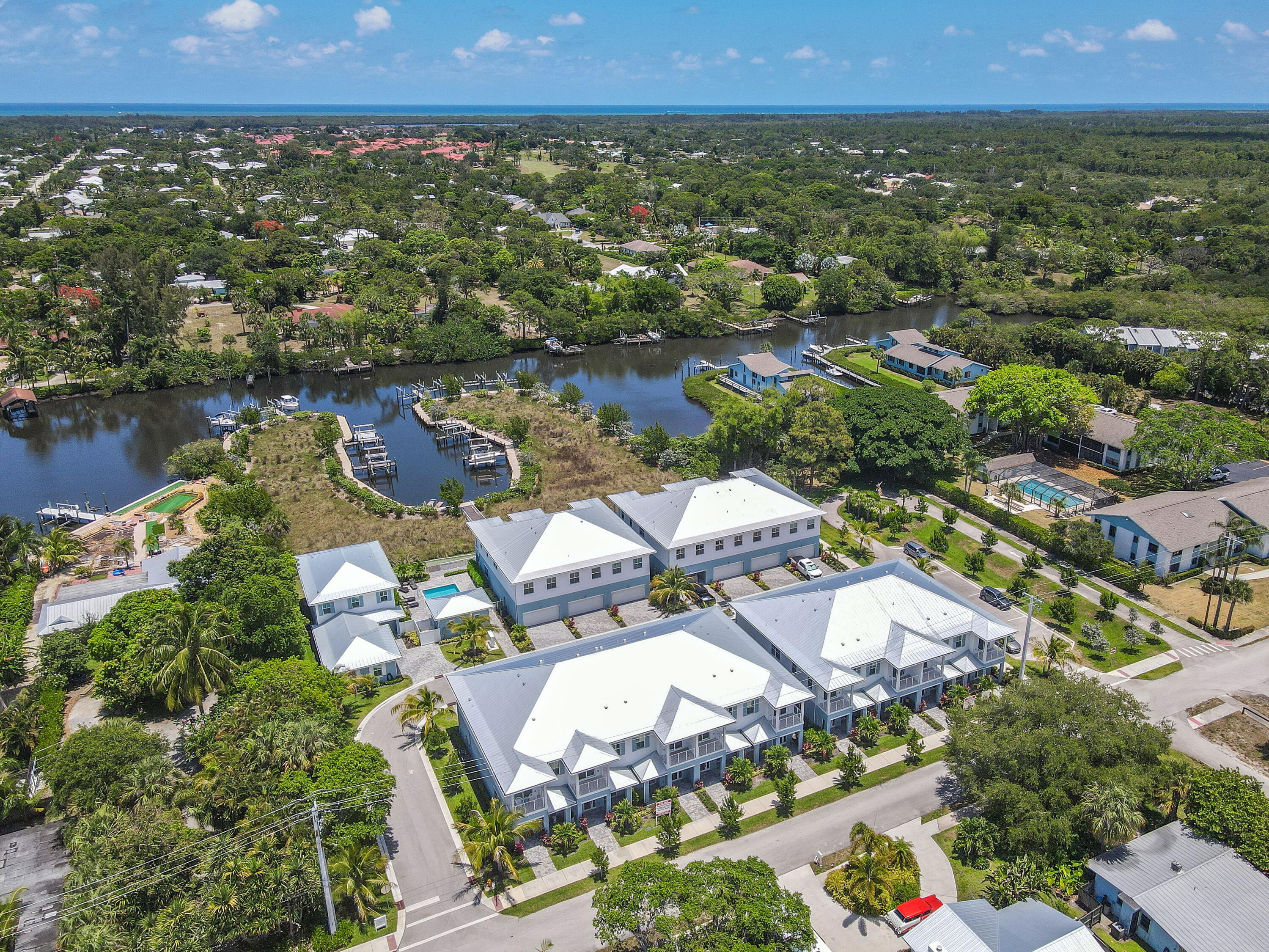 4650 Southeast Manatee Terrace Stuart, FL 34997 - Photo 72 of 95 an aerial view of residential house with outdoor space and lake view