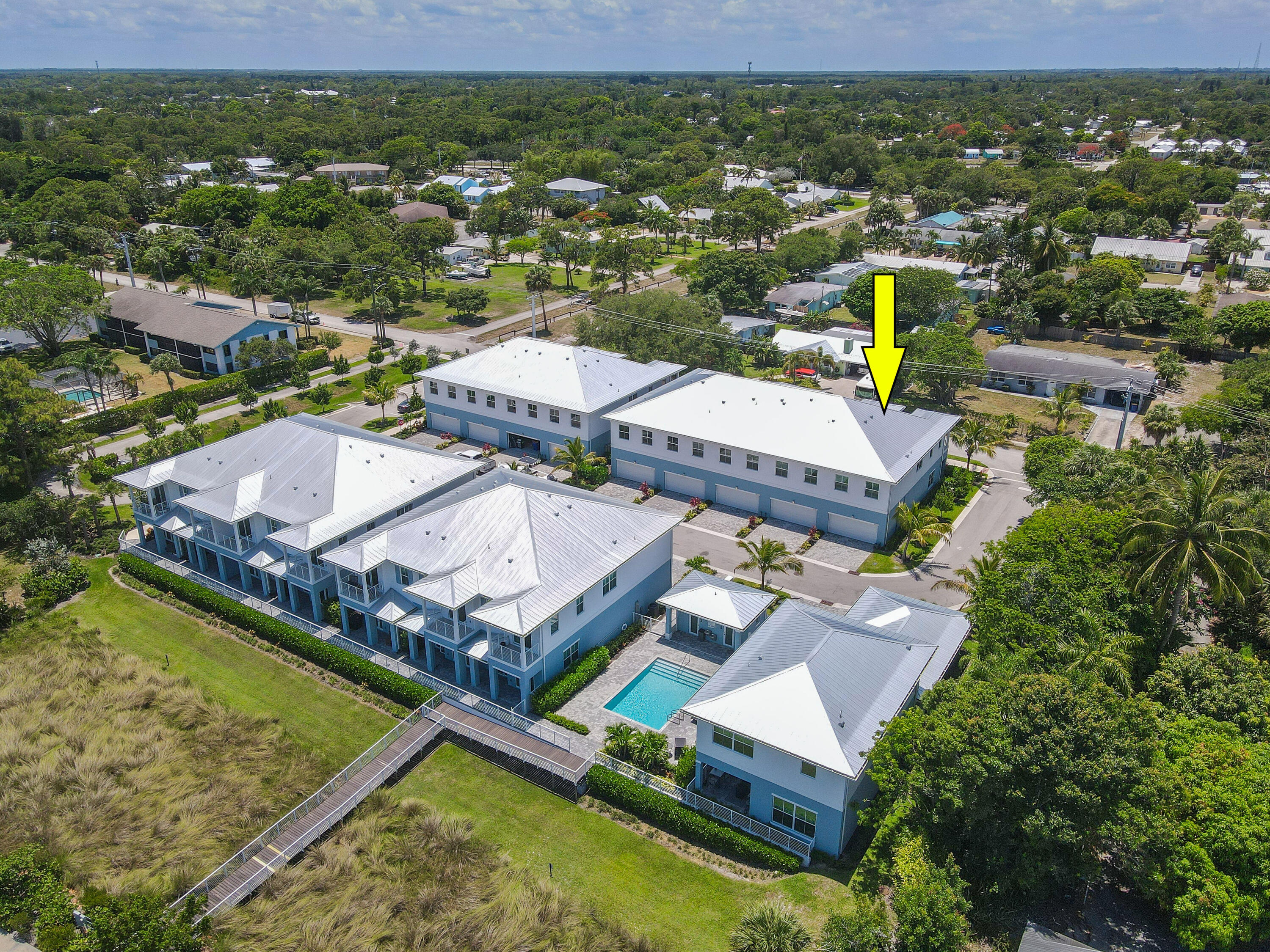 4650 Southeast Manatee Terrace Stuart, FL 34997 - Photo 93 of 95 an aerial view of a house with a garden and lake view
