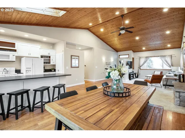 a living room with kitchen island furniture and a wooden floor
