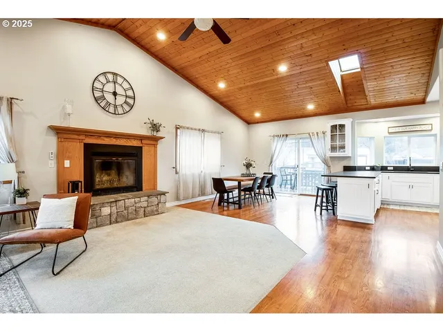 a living room with furniture and kitchen view