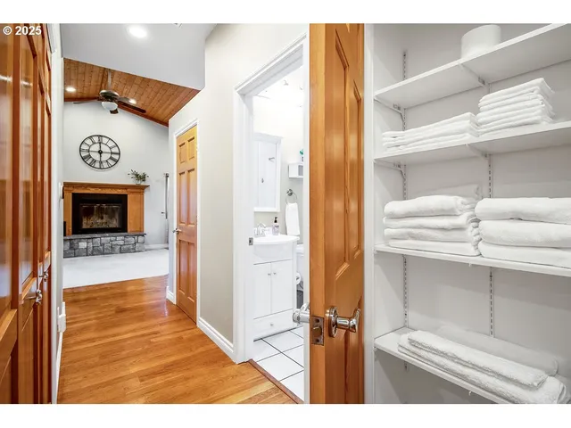 a spacious bedroom with a bed and glass door