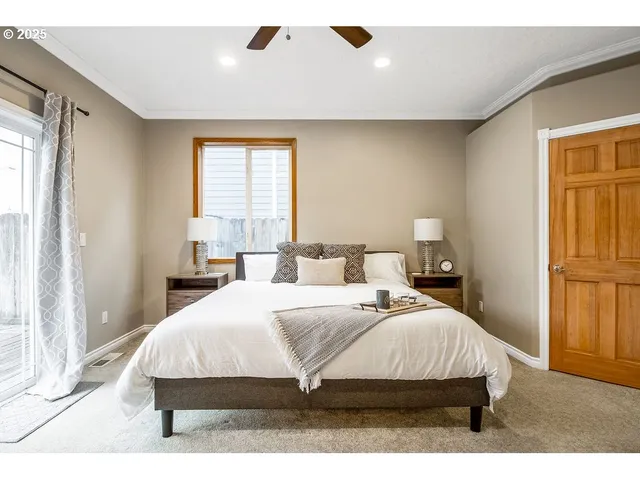 a bedroom with a bed and a lamp