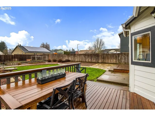 a swimming pool with outdoor seating and yard