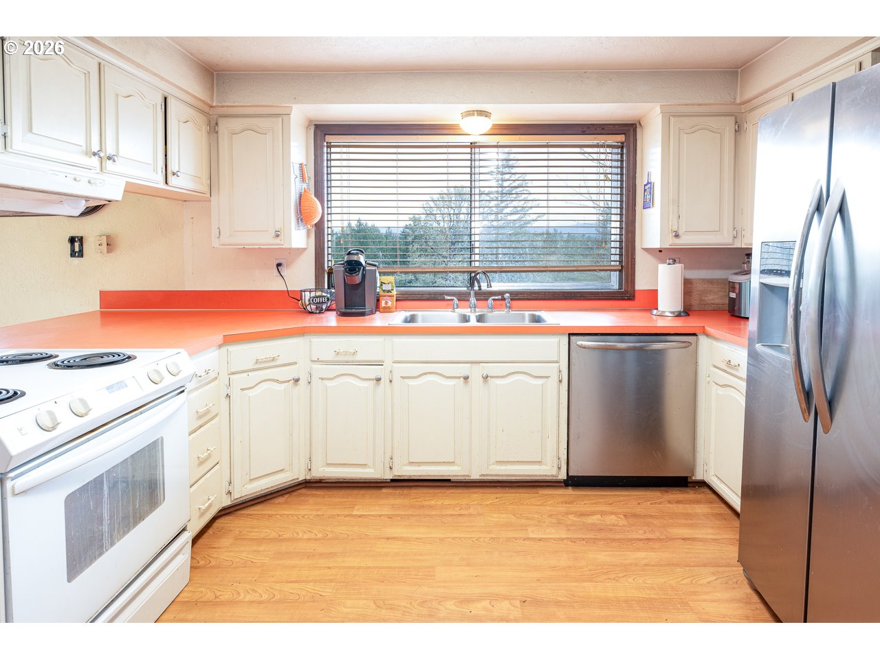 31514 Berlin Road Lebanon, OR 97355 - Photo 16 of 47 a kitchen with stainless steel appliances granite countertop a stove a sink and a refrigerator