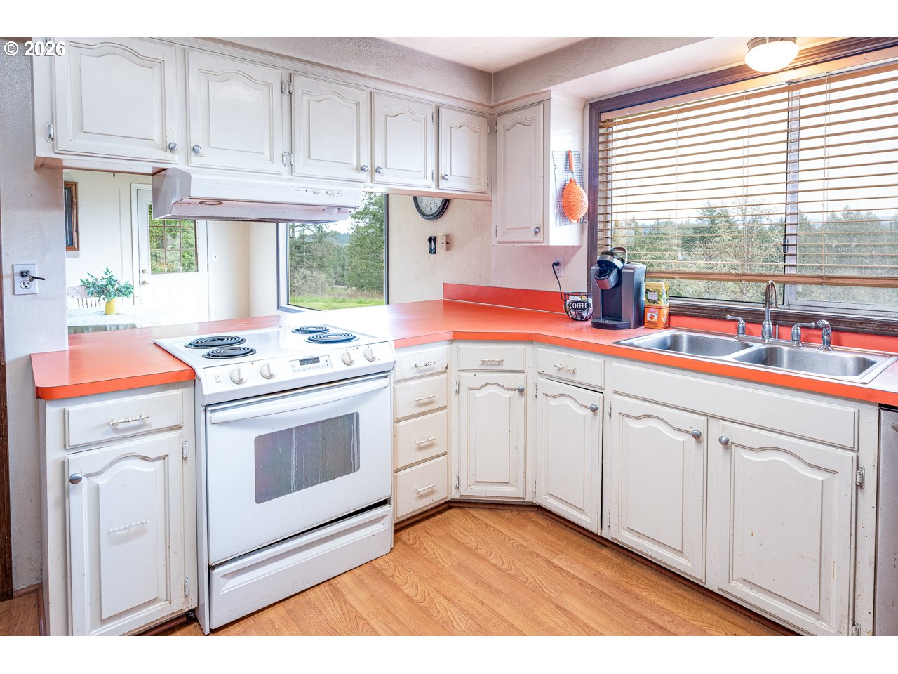 31514 Berlin Road Lebanon, OR 97355 - Photo 18 of 47 a kitchen with stainless steel appliances granite countertop a stove a sink and white cabinets