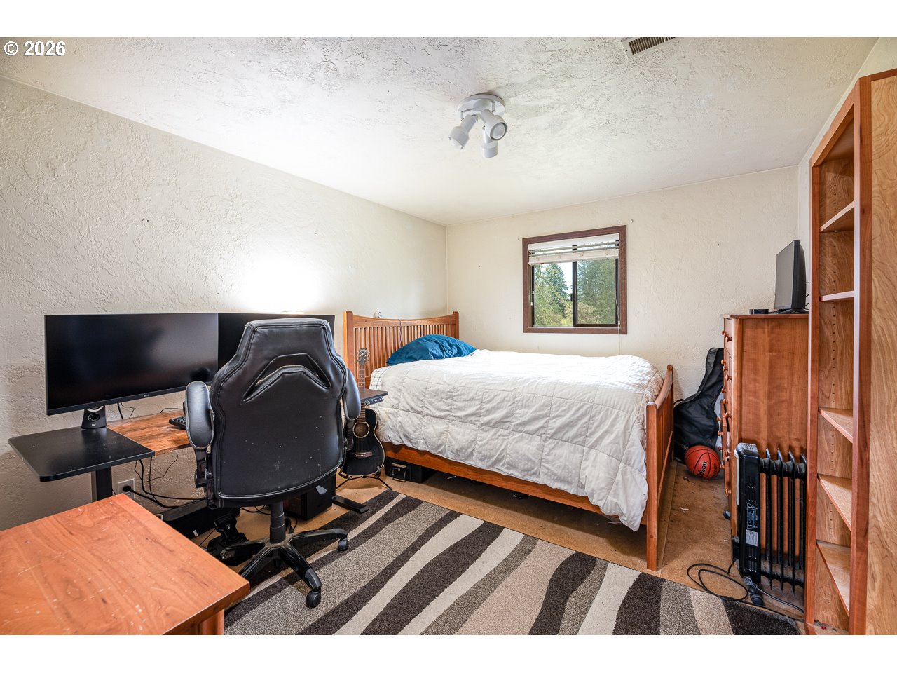 31514 Berlin Road Lebanon, OR 97355 - Photo 28 of 47 a bedroom with a bed and wooden floor