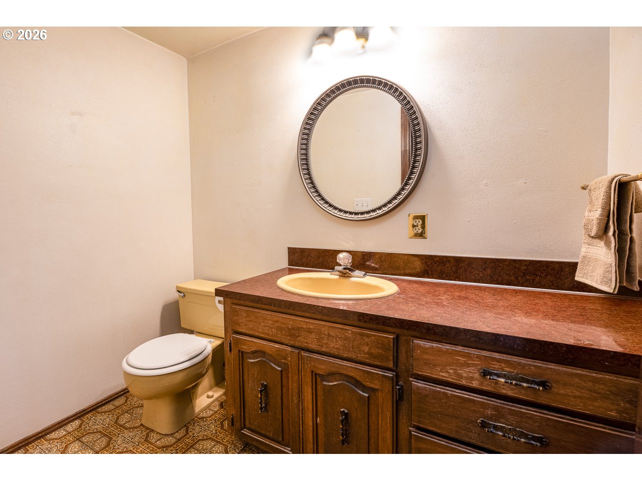 31514 Berlin Road Lebanon, OR 97355 - Photo 31 of 47 a bathroom with a granite countertop toilet a sink and a mirror
