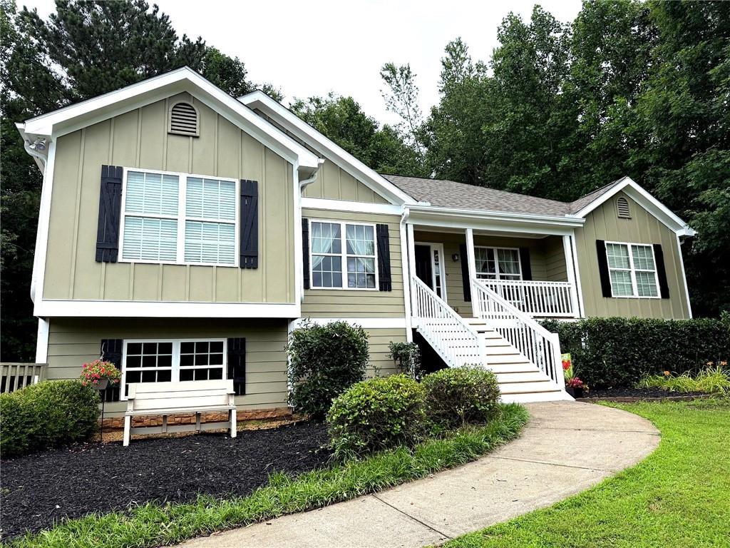a front view of a house with garden