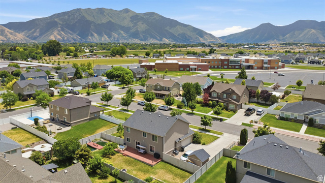 592 West 650 South Springville, UT 84663 - Photo 30 of 33 Residential neighborhood featuring multiple two-story homes with pitched roofs and manicured lawns
