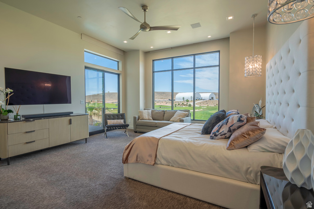 3606 South Cypress Road Hurricane, UT 84737 - Photo 28 of 69 Bedroom with a ceiling fan, dark colored carpet, access to exterior, and recessed lighting