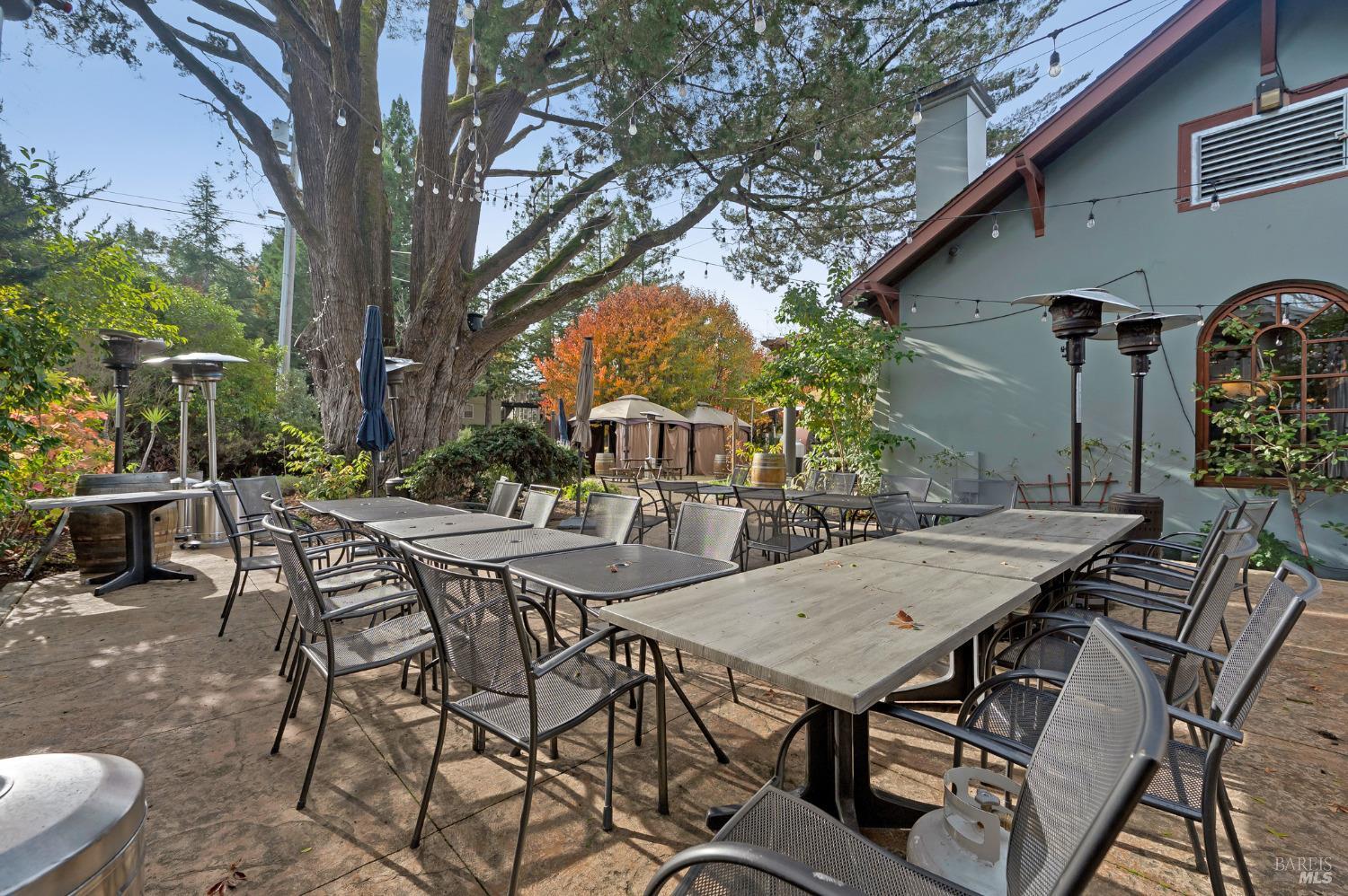 8050 Bodega Avenue Sebastopol, CA 95472 - Photo 25 of 45 a view of a patio with table and chairs and potted plants
