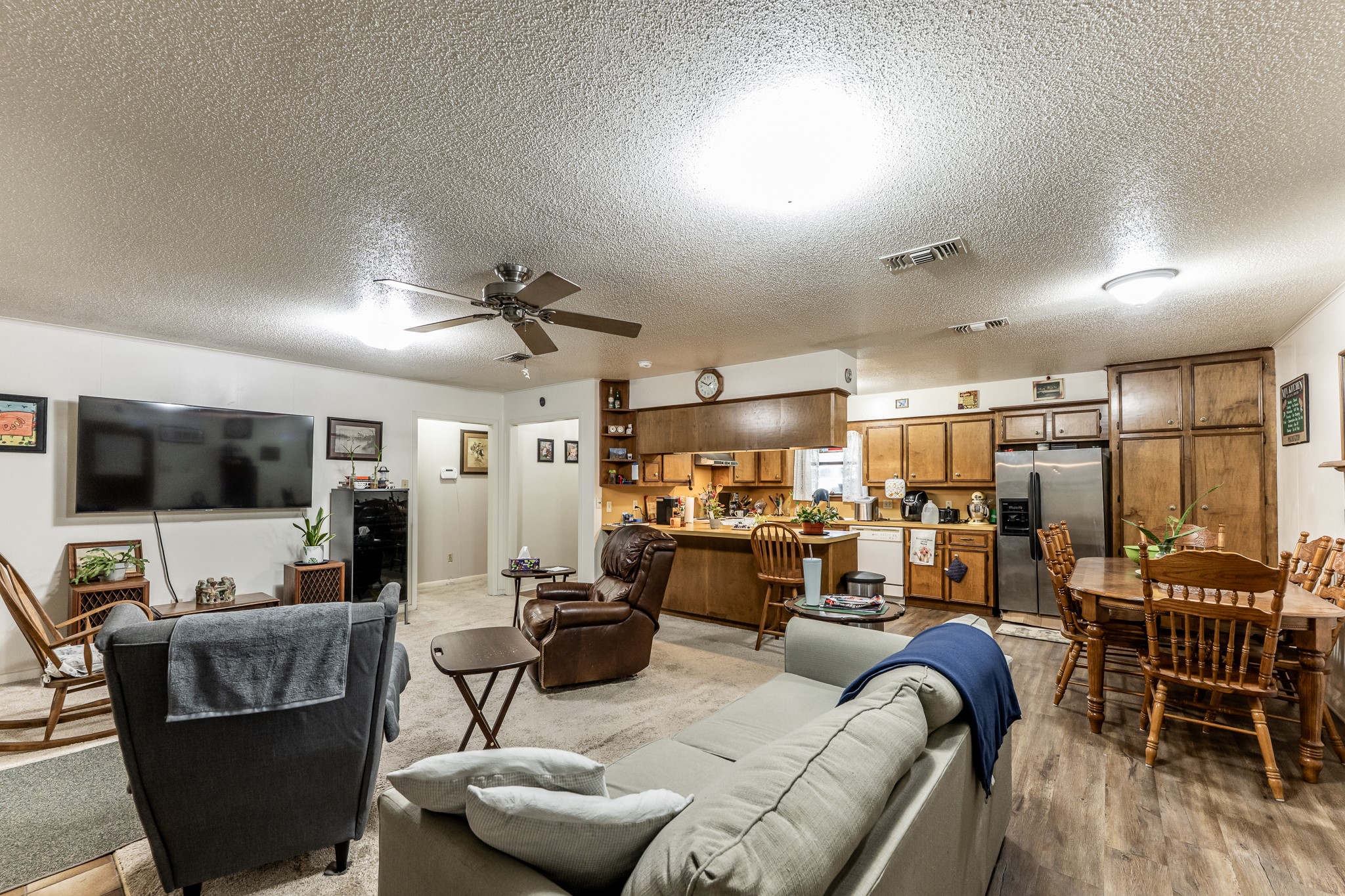 3304 Parr Drive Huntsville, TX 77320 - Photo 25 of 40 a living room with furniture and a flat screen tv