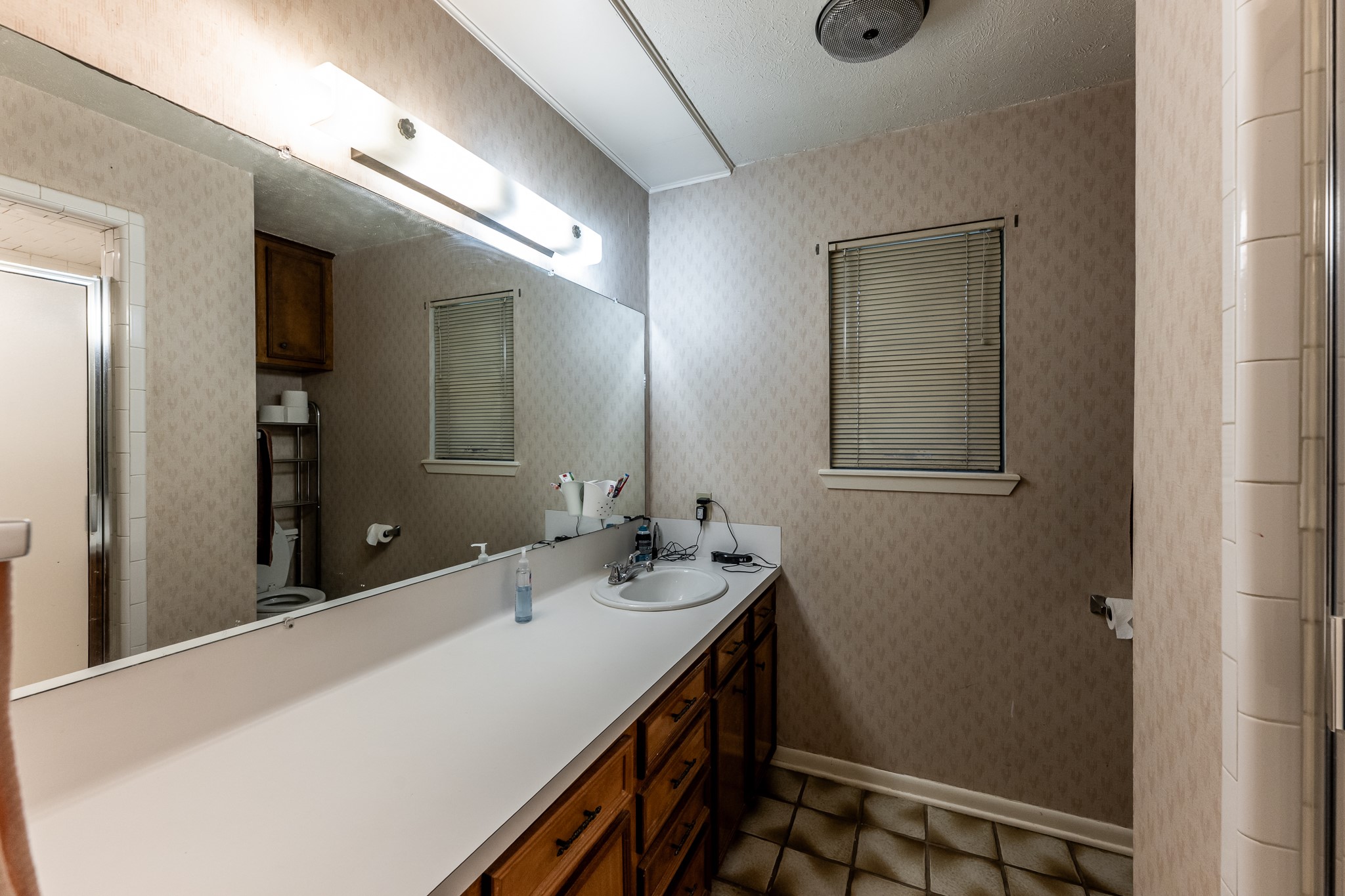 3304 Parr Drive Huntsville, TX 77320 - Photo 32 of 40 a bathroom with a sink and a mirror