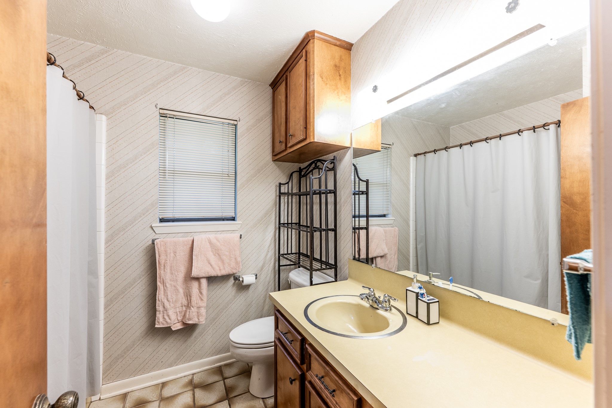 3304 Parr Drive Huntsville, TX 77320 - Photo 34 of 40 a bathroom with a sink and a mirror