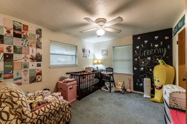 a bedroom with bed and a window