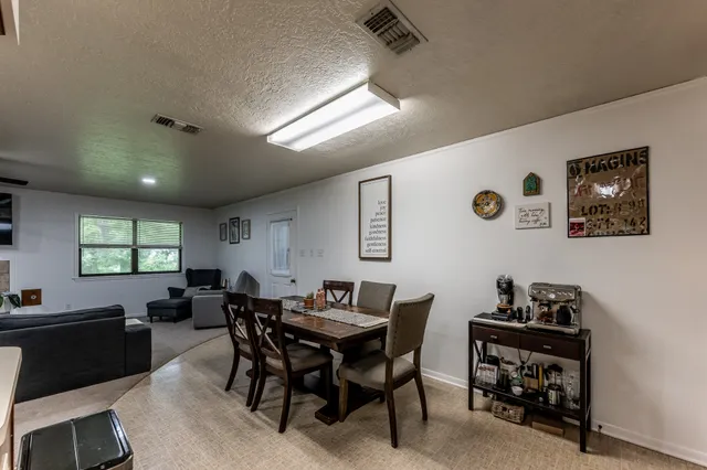 a view of a dining room with furniture