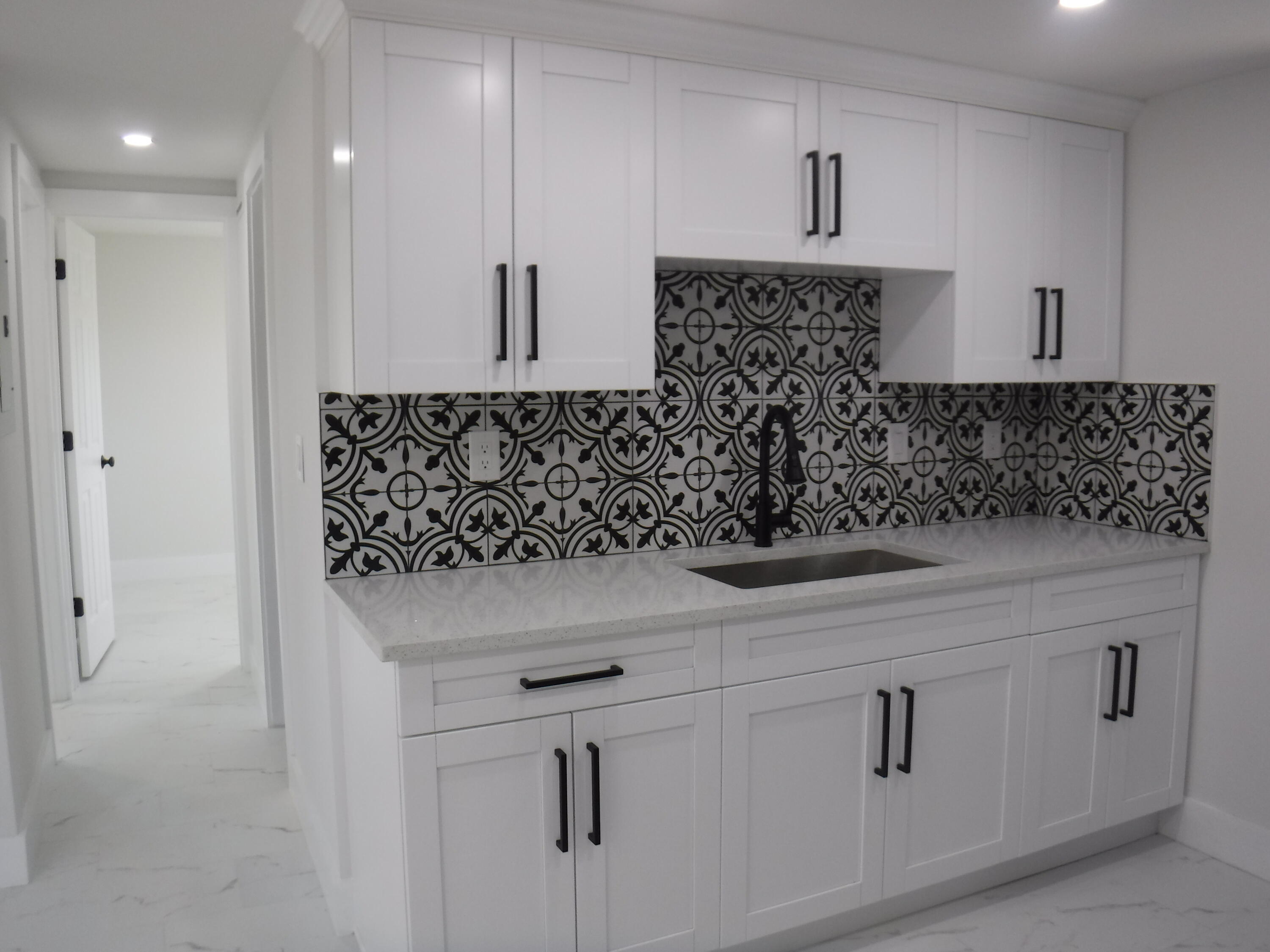 1280 Sunset Road West Palm Beach, FL 33406 - Photo 13 of 24 a bathroom with a bathtub and shower