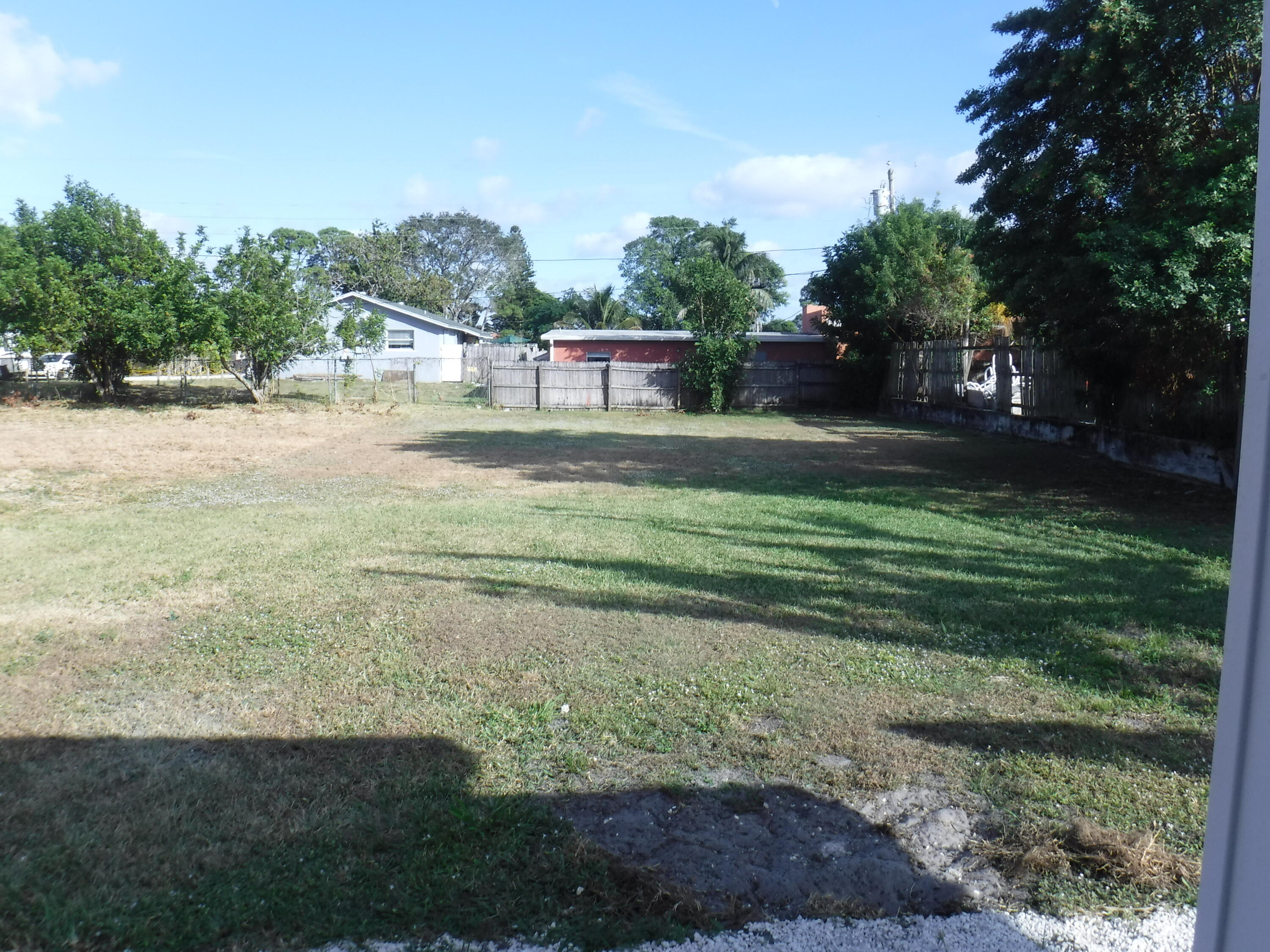 1280 Sunset Road West Palm Beach, FL 33406 - Photo 18 of 24 a view of a park with large trees