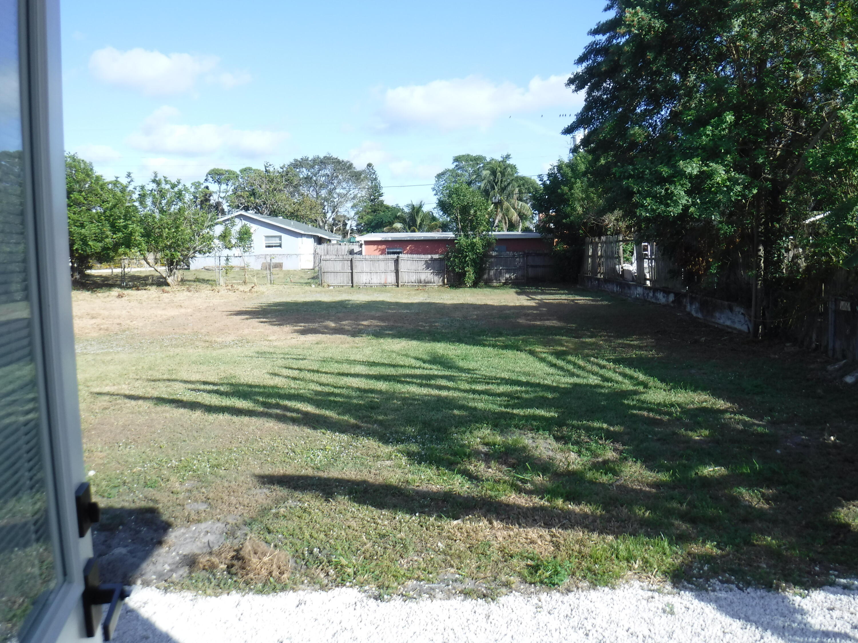 1280 Sunset Road West Palm Beach, FL 33406 - Photo 21 of 24 a view of a back yard of the house