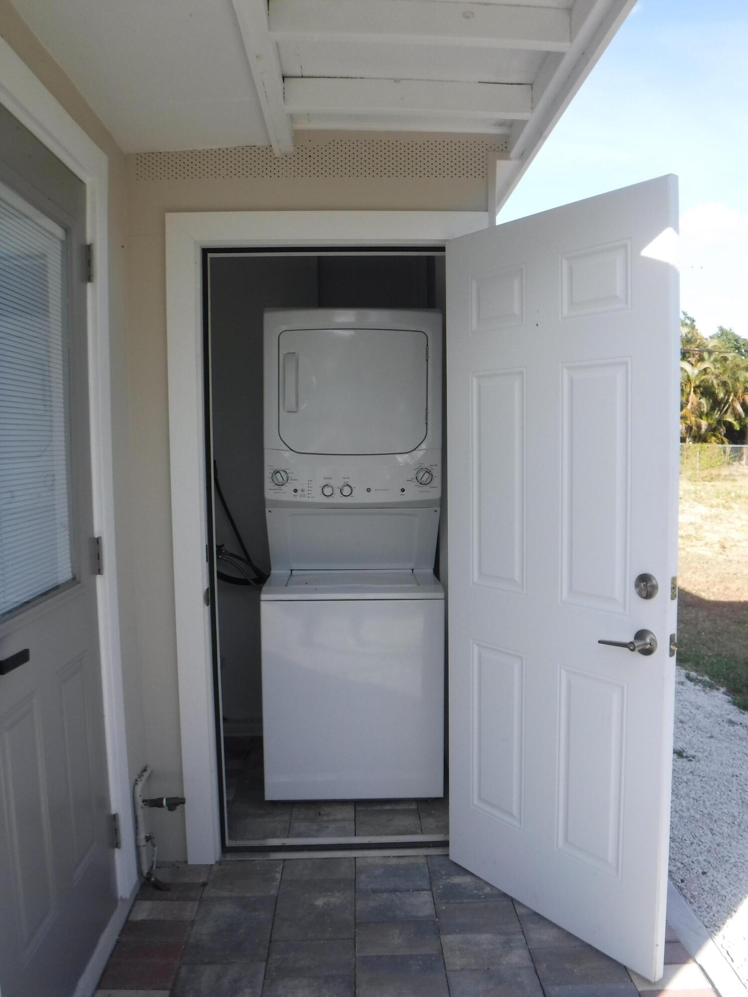 1280 Sunset Road West Palm Beach, FL 33406 - Photo 24 of 24 a utility room with dryer and washer