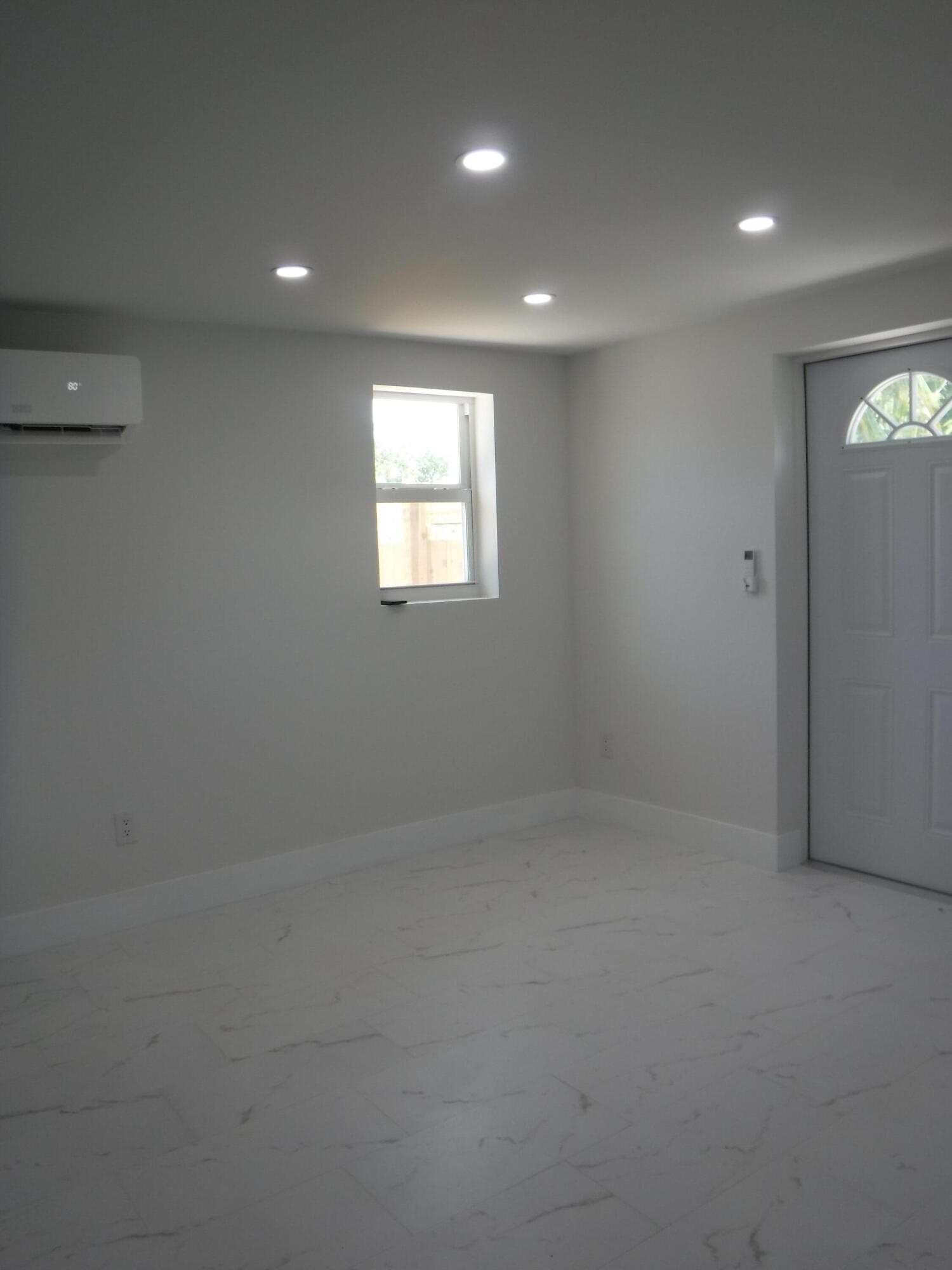 1280 Sunset Road West Palm Beach, FL 33406 - Photo 4 of 24 an empty room with a window