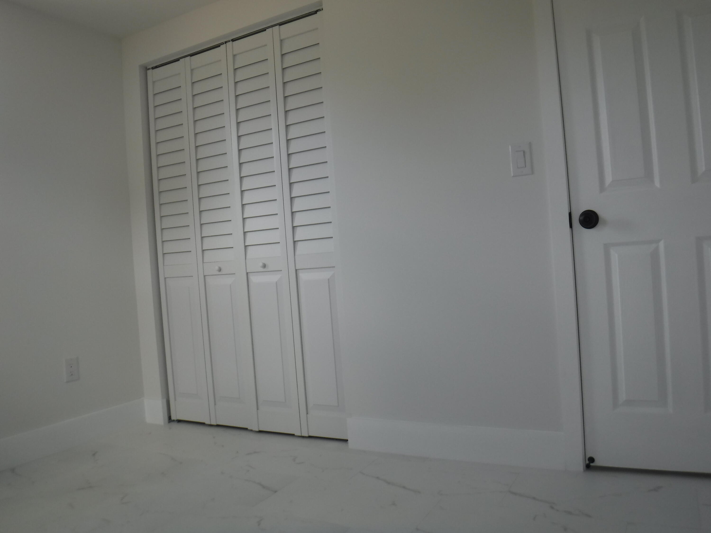 1280 Sunset Road West Palm Beach, FL 33406 - Photo 6 of 24 a view of a closet area