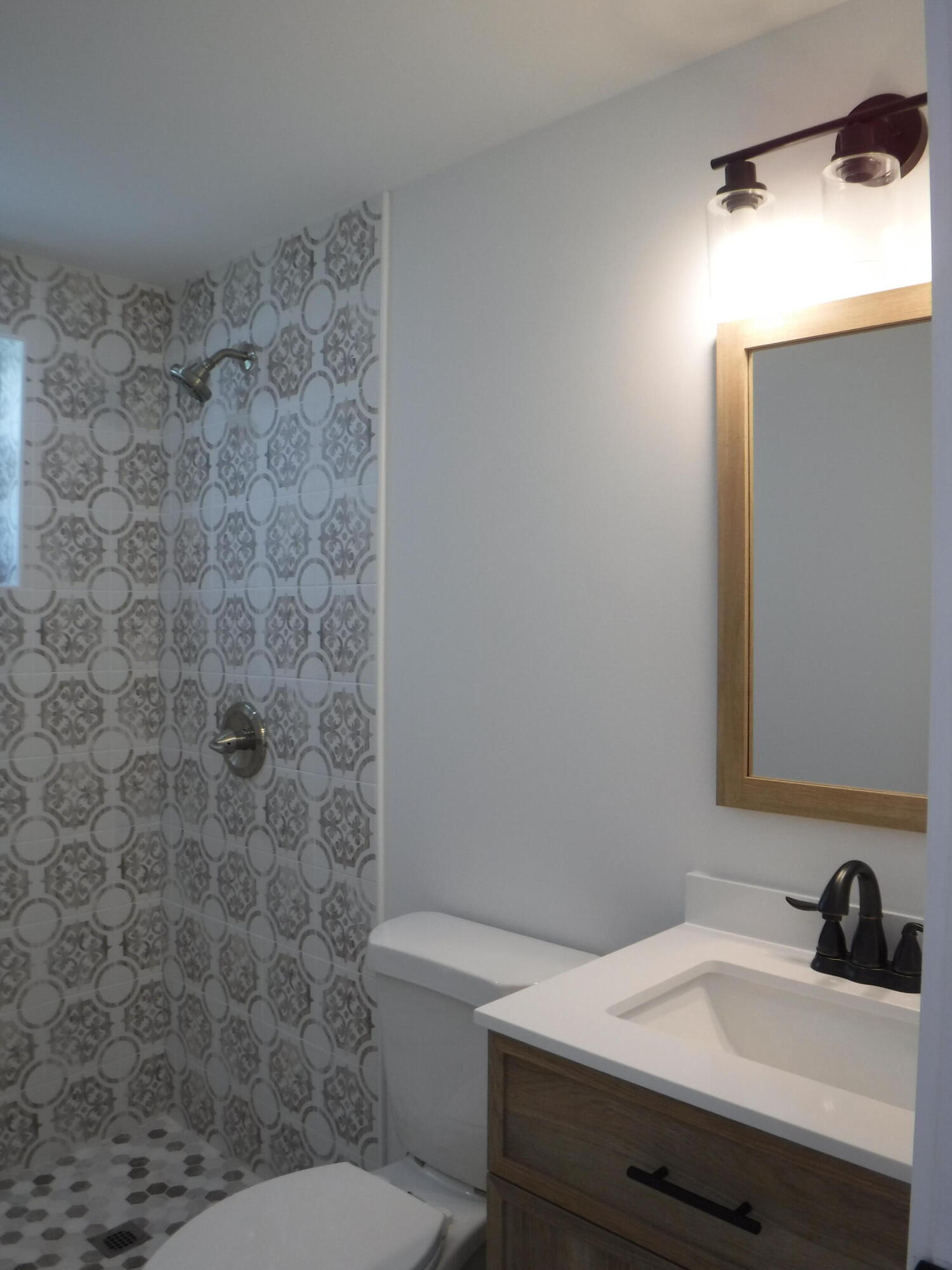 1280 Sunset Road West Palm Beach, FL 33406 - Photo 10 of 24 a bathroom with a sink a toilet and shower