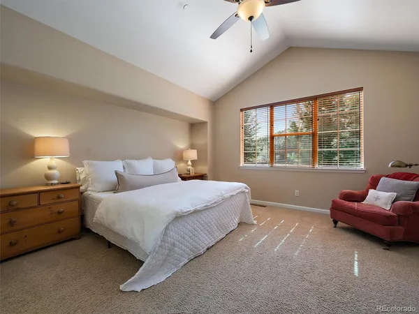 a bedroom with bed and window