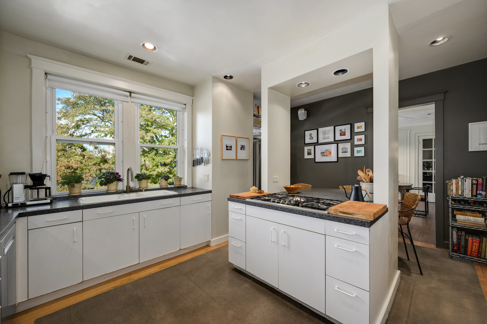 4224 North Hazel Street, Unit 3 Chicago, IL 60613 - Photo 22 of 33 a kitchen that has a sink stove and cabinets