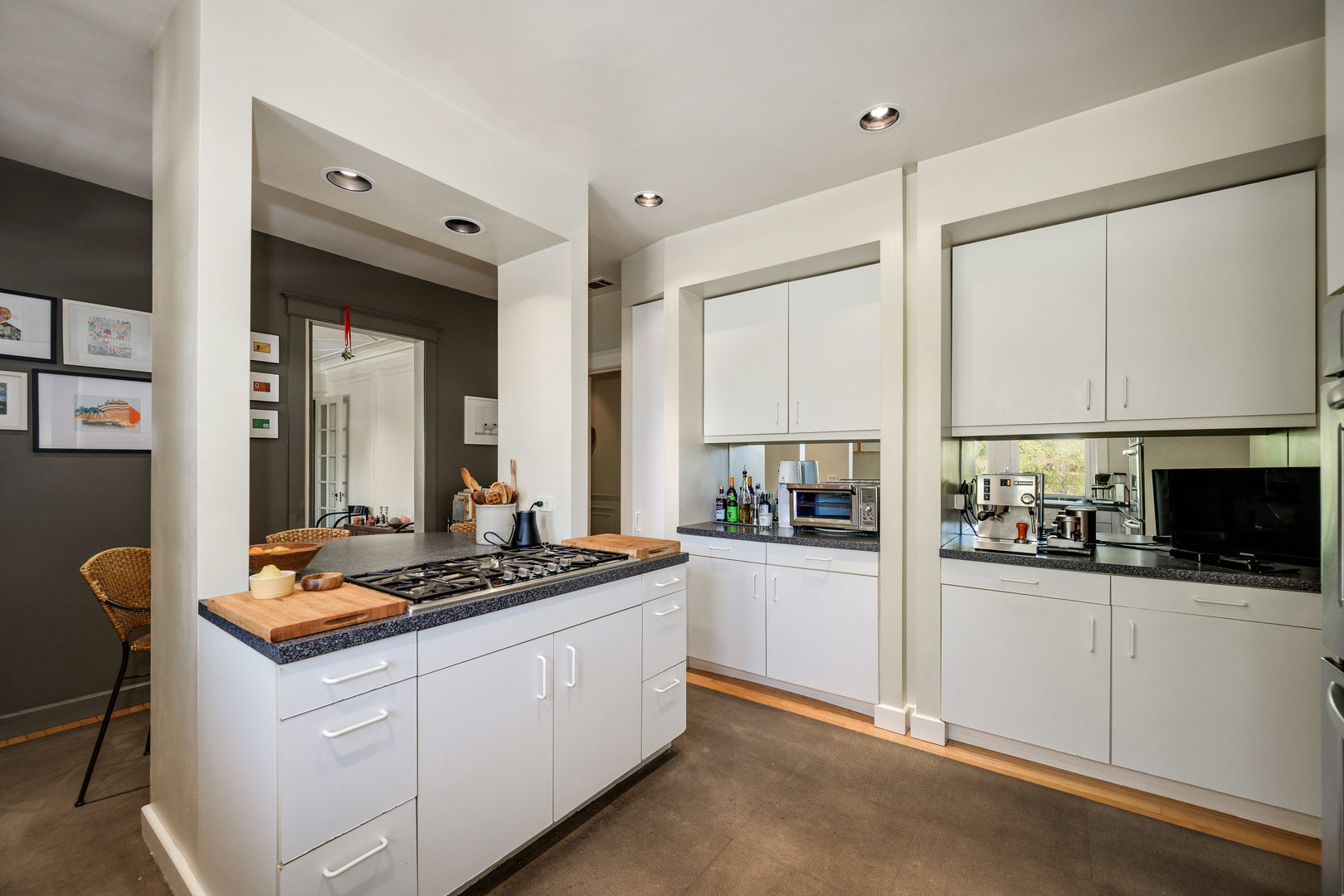 4224 North Hazel Street, Unit 3 Chicago, IL 60613 - Photo 24 of 33 a kitchen with stainless steel appliances granite countertop a stove a sink and a refrigerator with white cabinets