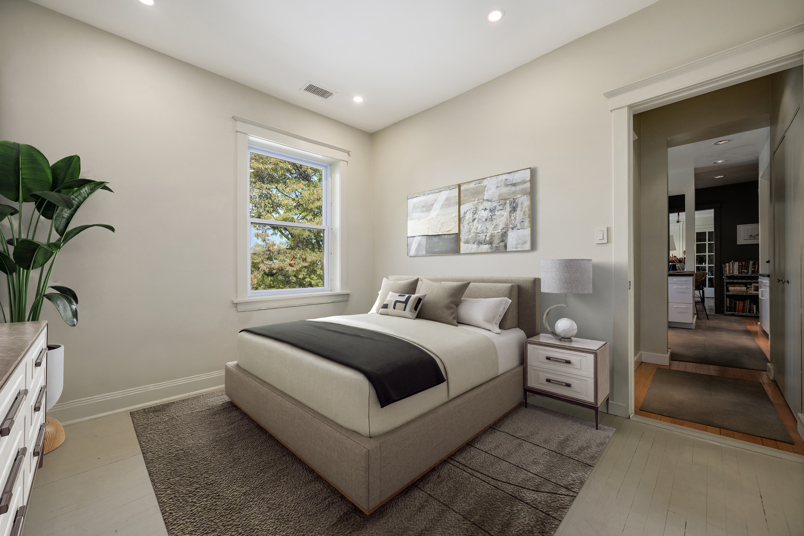 4224 North Hazel Street, Unit 3 Chicago, IL 60613 - Photo 26 of 33 a large bedroom with a bed and a window