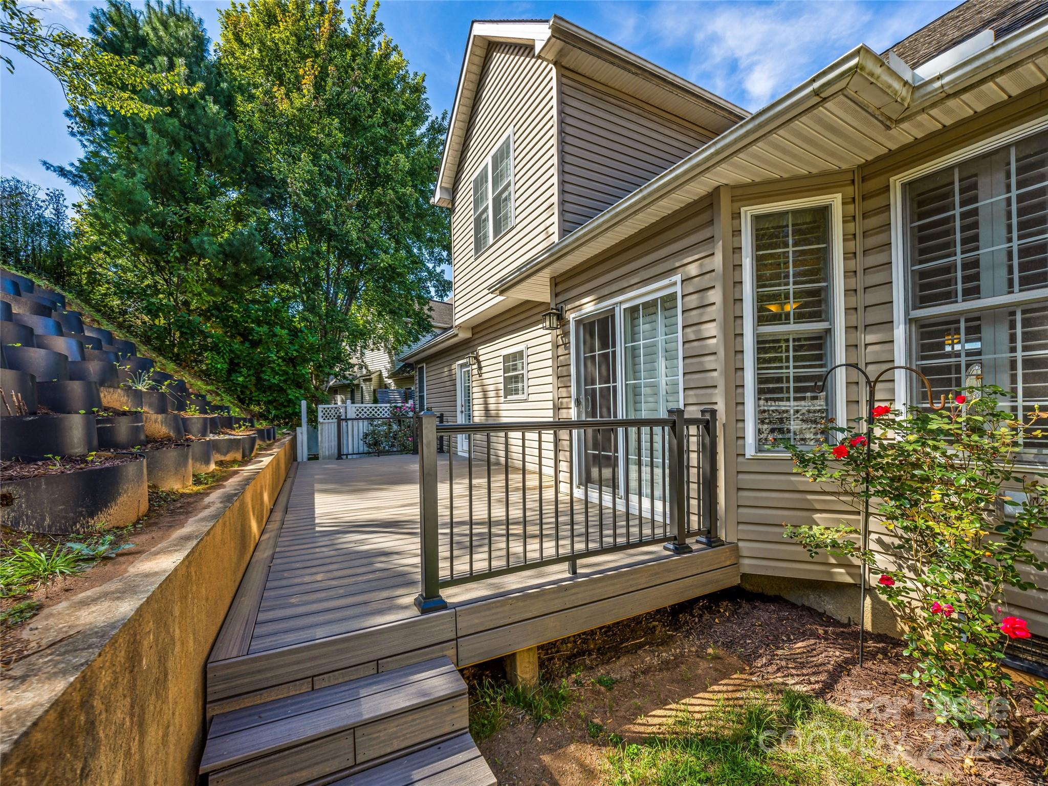 51 Driftstone Circle Arden, NC 28704 - Photo 21 of 38 a view of a house with backyard and sitting area