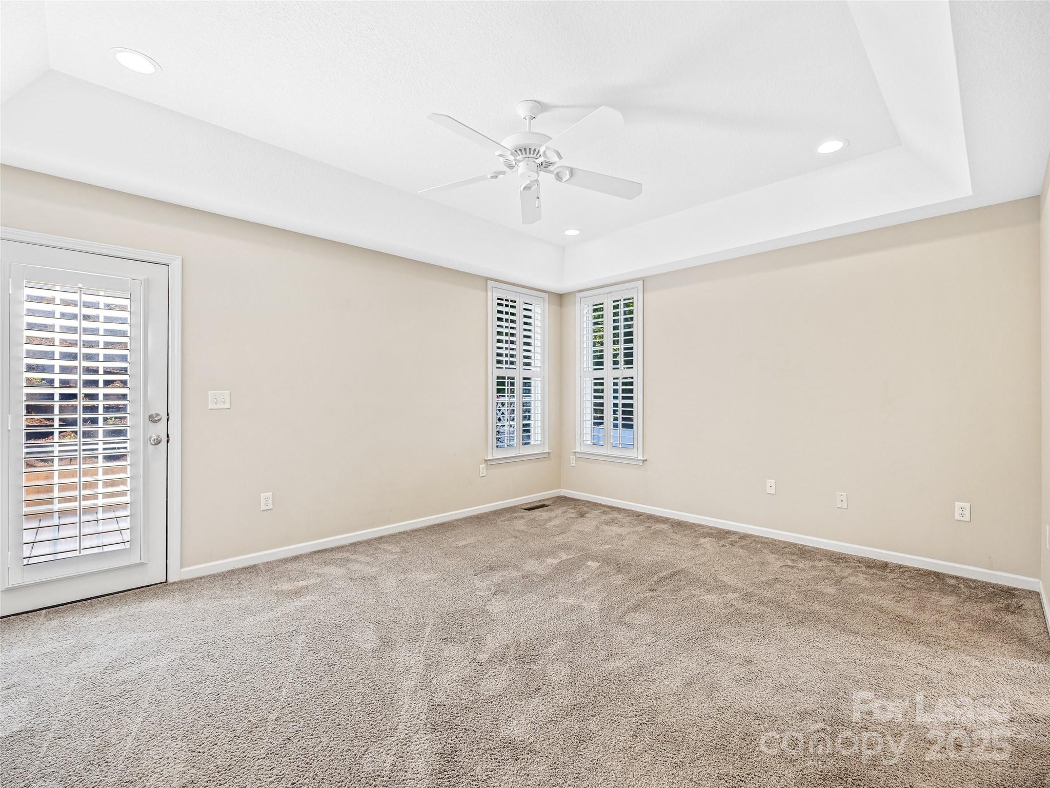 51 Driftstone Circle Arden, NC 28704 - Photo 24 of 38 an empty room with windows and ceiling fan