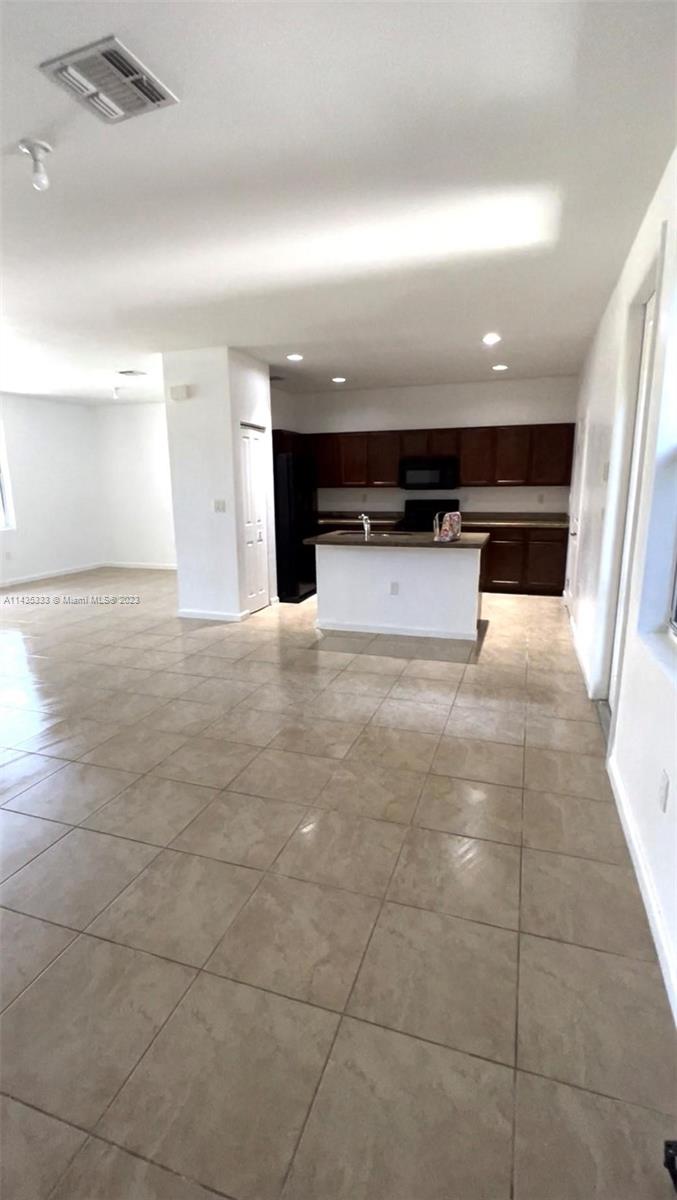 11665 Southwest 244 Street, Unit 116 Homestead, FL 33032 - Photo 2 of 32 a view of kitchen with microwave and a sink