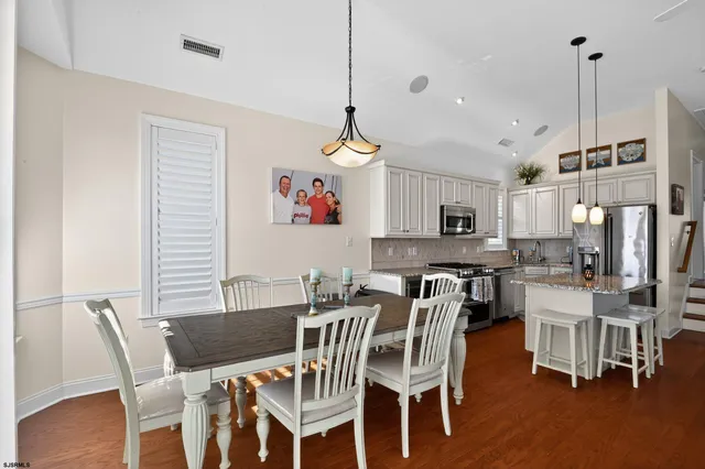 a view of a dining room with furniture