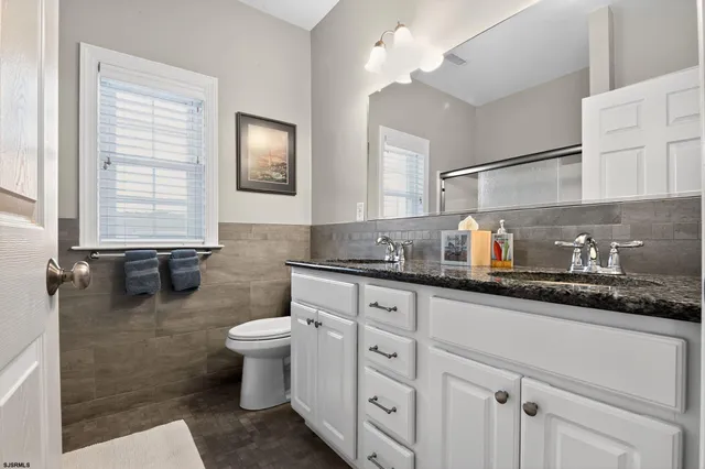 a kitchen with sink a stove and cabinets