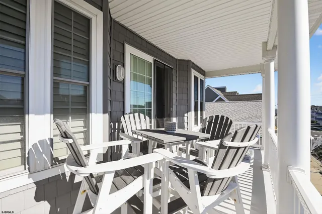 a view of an chairs and table in the balcony