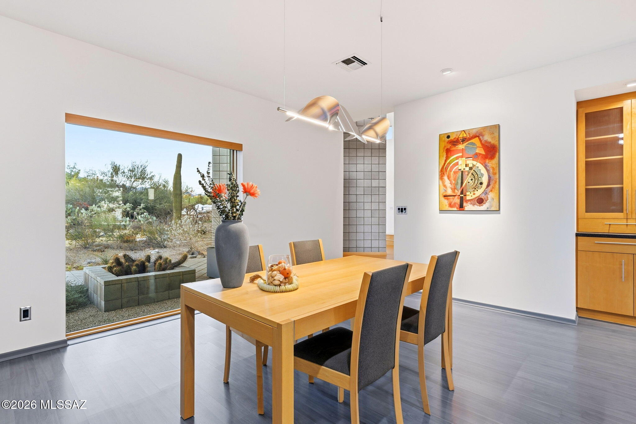 5070 North Valley View Road Tucson, AZ 85718 - Photo 17 of 51 a view of a dining room with furniture window and wooden floor