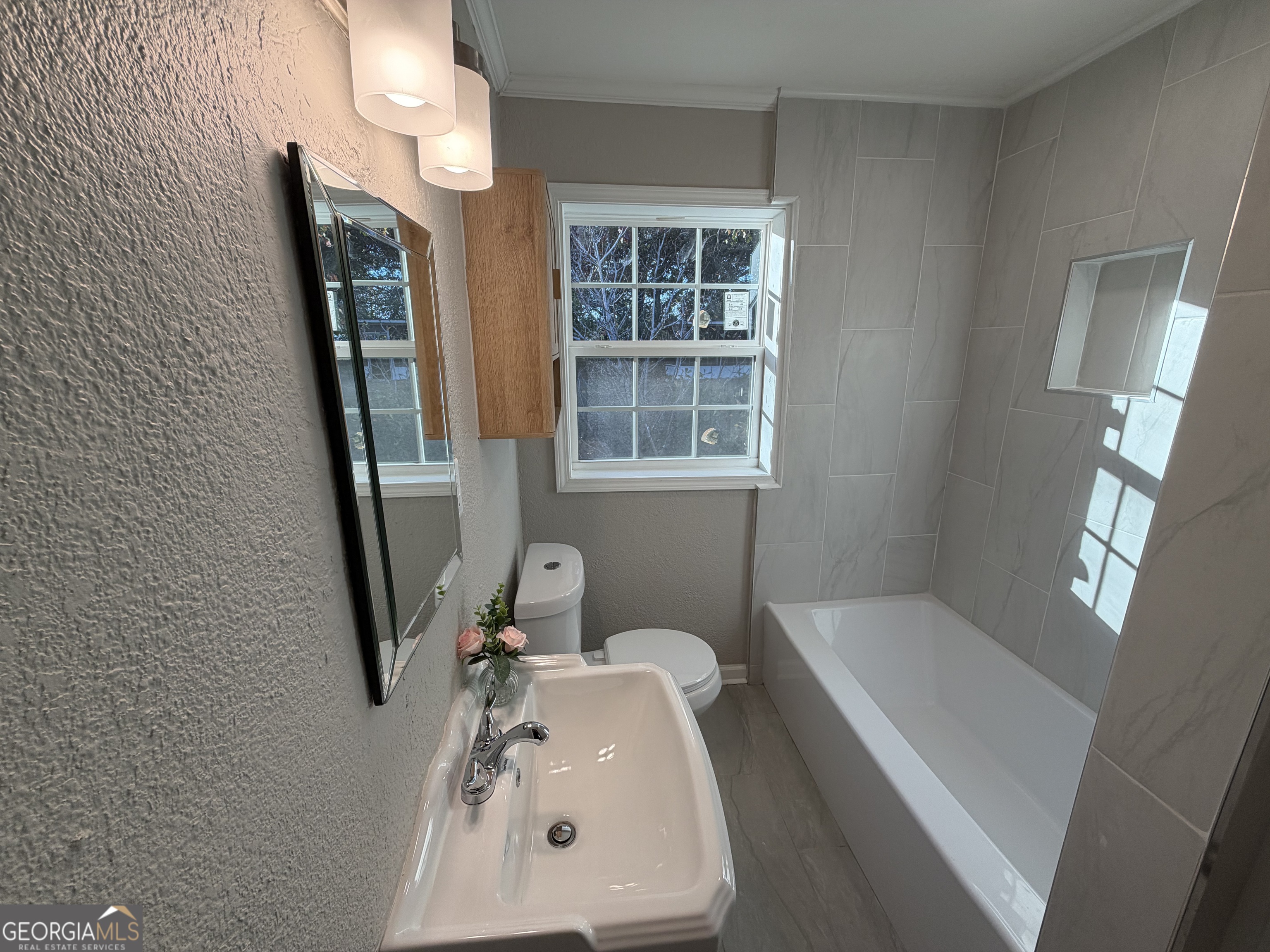 116 Country Club Road Dublin, GA 31021 - Photo 19 of 22 a bathroom with a sink and a mirror